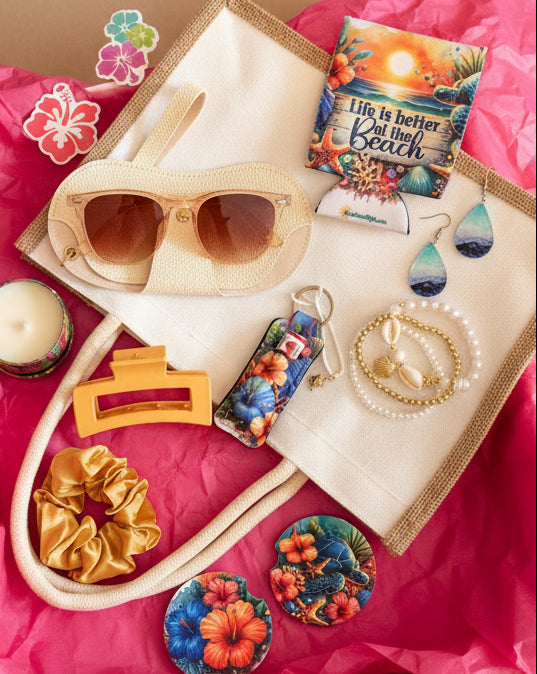 Collection of beach vibing accessories including sunglasses, hair accessories, and small tote bag.